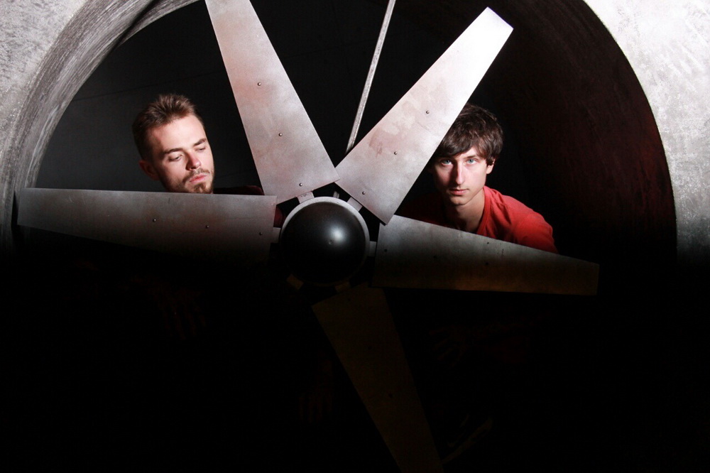 Alexander and Ivan from the IMIRA band near the huge propeller